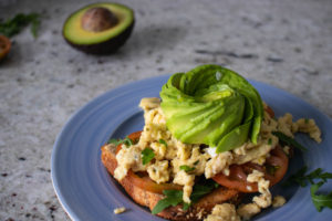Avocado toast with scrambled eggs breakfast