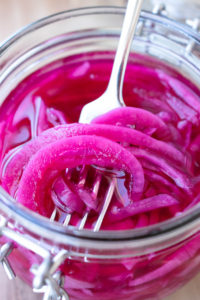 Pickled Red Onions in a jar.