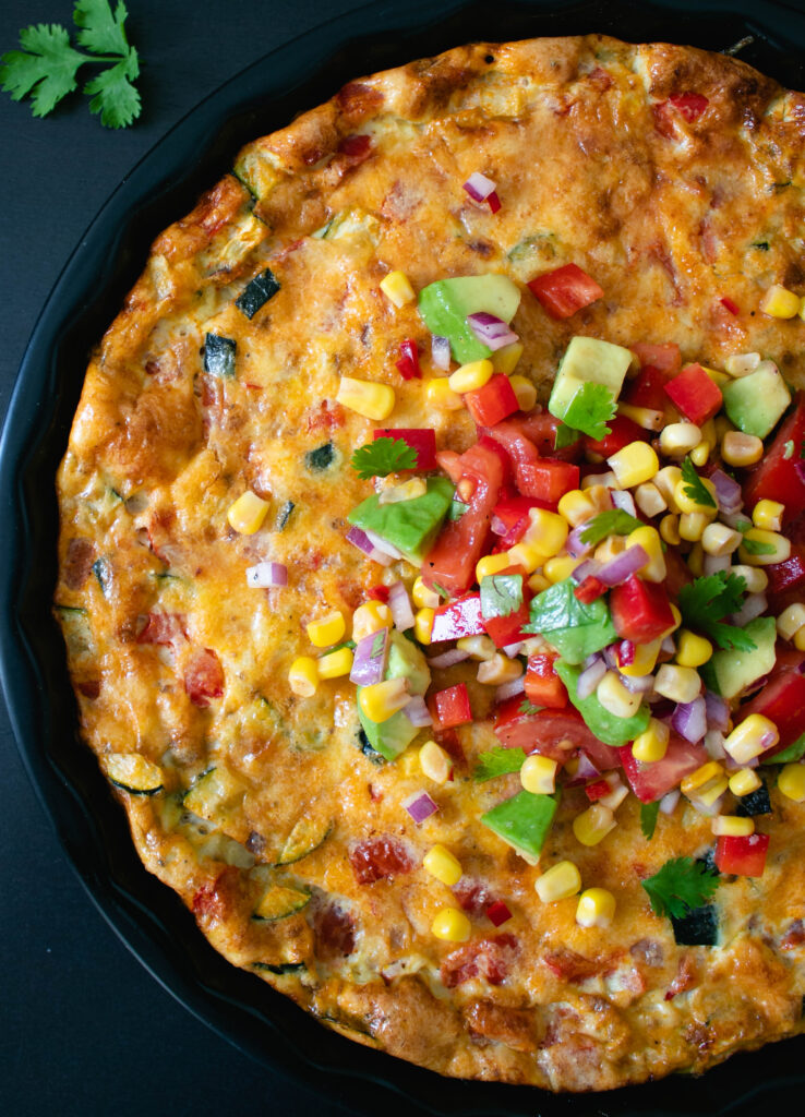 Mexican Baked Frittata topped with salsa.