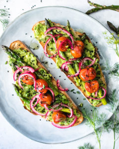 Avocado toast with grilled asparagus and tomatoes