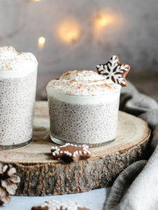 Gingerbread Chia Pudding served in 2 glasses, topped with yogurt.