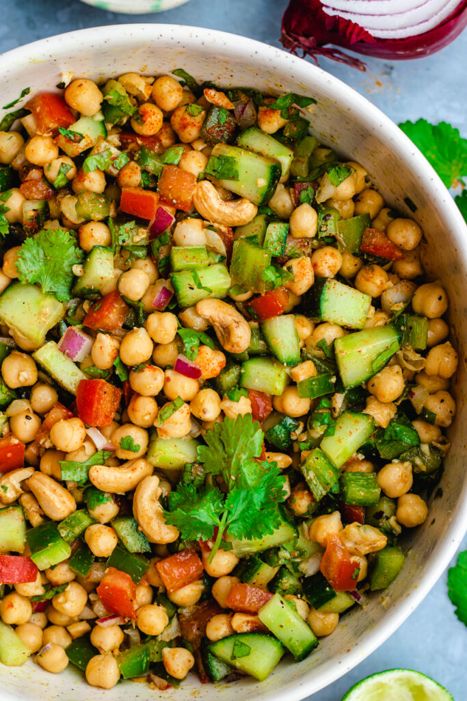 Indian chickpea salad served in a white bowl.