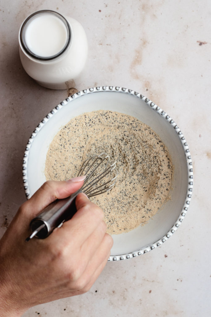 Stirring together the the chia seeds and protein powder.
