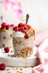 Protein Chia Pudding served with homemade granola, yoghurt, peanut butter and raspberries
