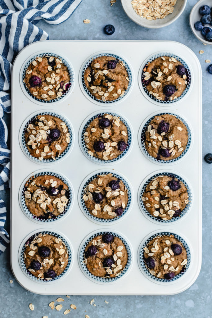 baked Banana blueberry oatmeal muffins in the muffin tray.