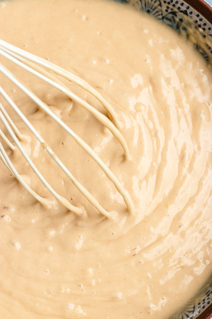 Instructional photo, stirring the batter with a whisk.