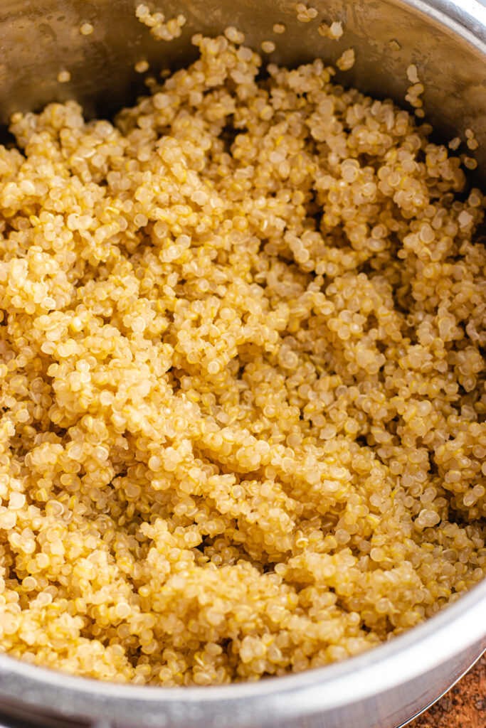 The cooked quinoa in a small pot.