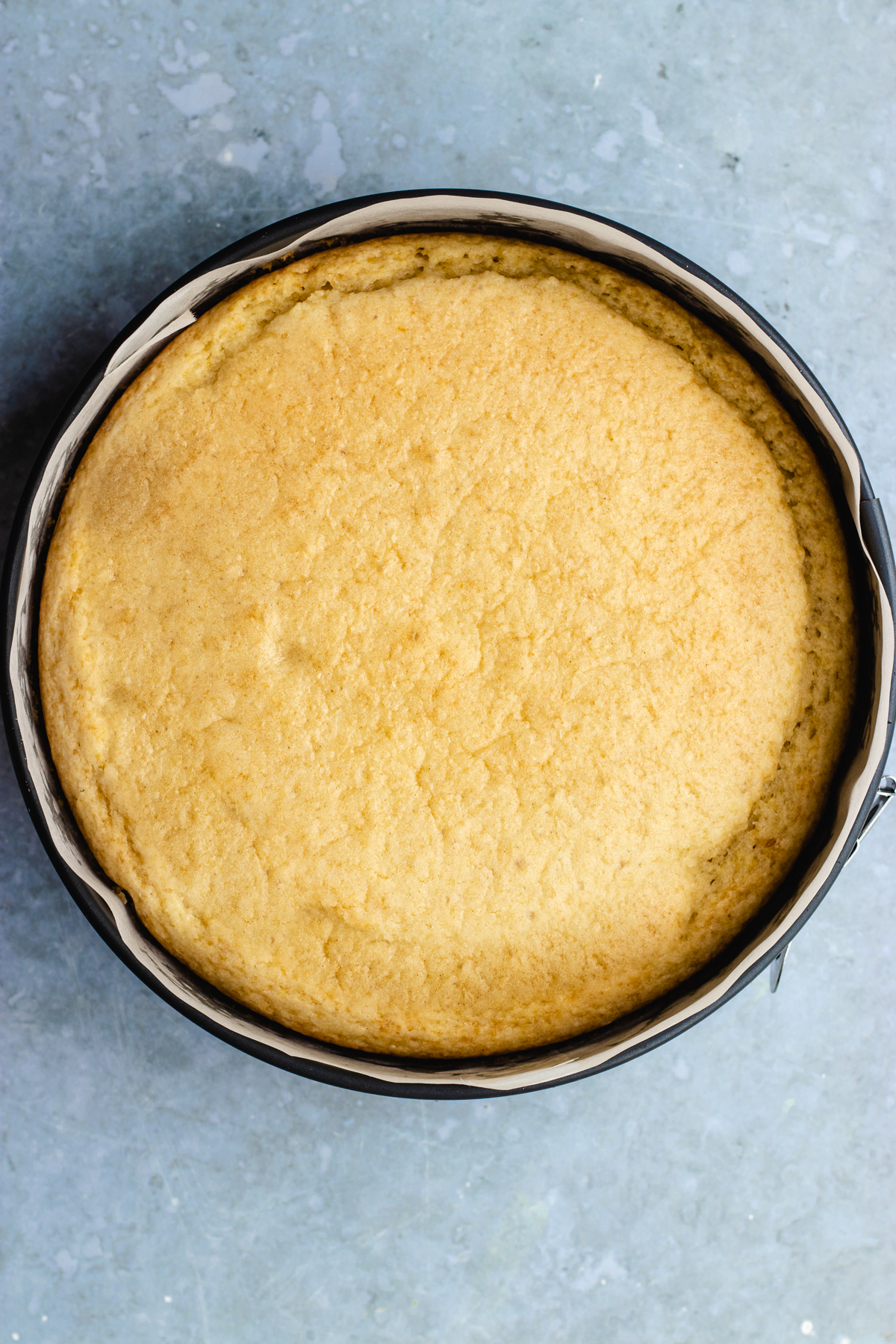 The baked cake in the baking pan.