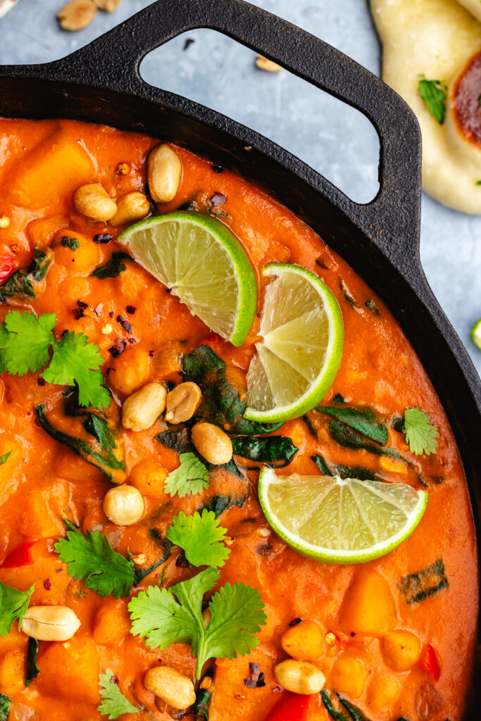 Butternut squash chickpea curry topped with lime, peanuts and cilantro.