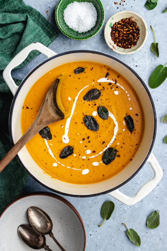 The Roasted butternut squash and carrot soup topped with coconut cream, fried sage and spices.