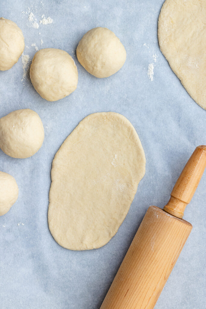 The polled out dough with a rolling pin.