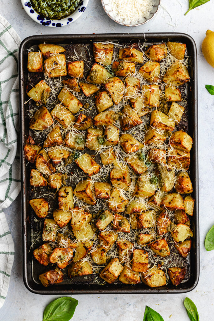 The roasted potatoes on the baking tray. 