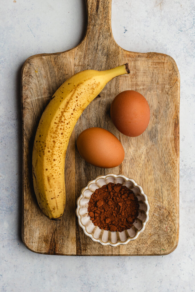 The ingredients on a wooden cutting board. 