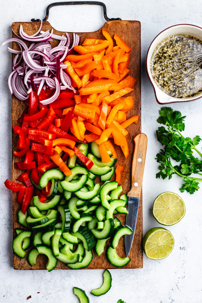 The chopped vegetables on the cutting board.
