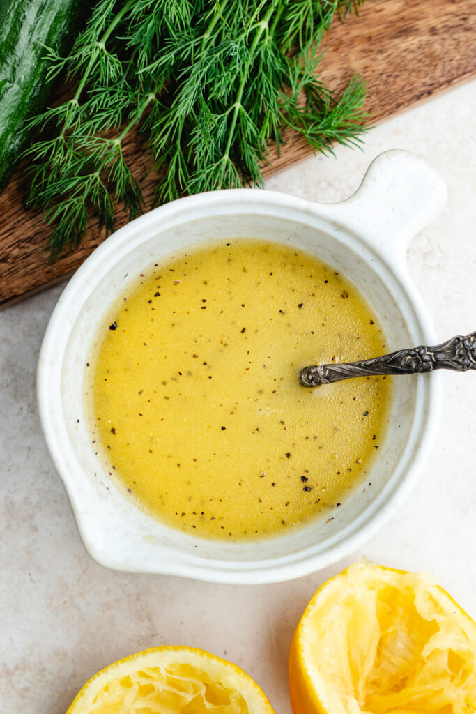 The dressing in a small bowl. 