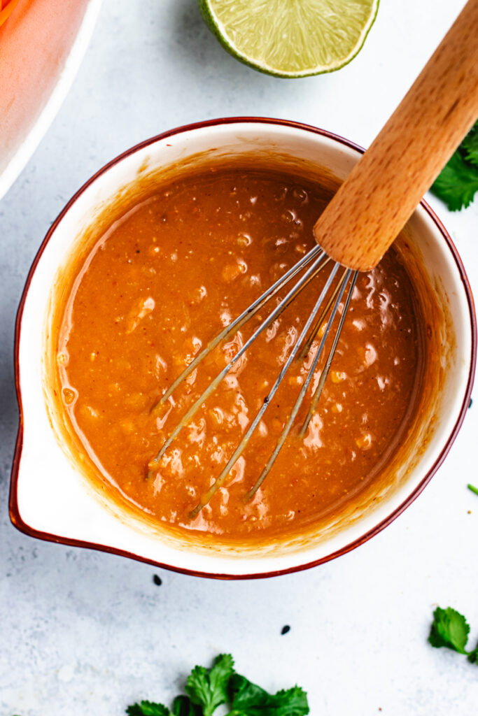 The dressing in a small bowl. 