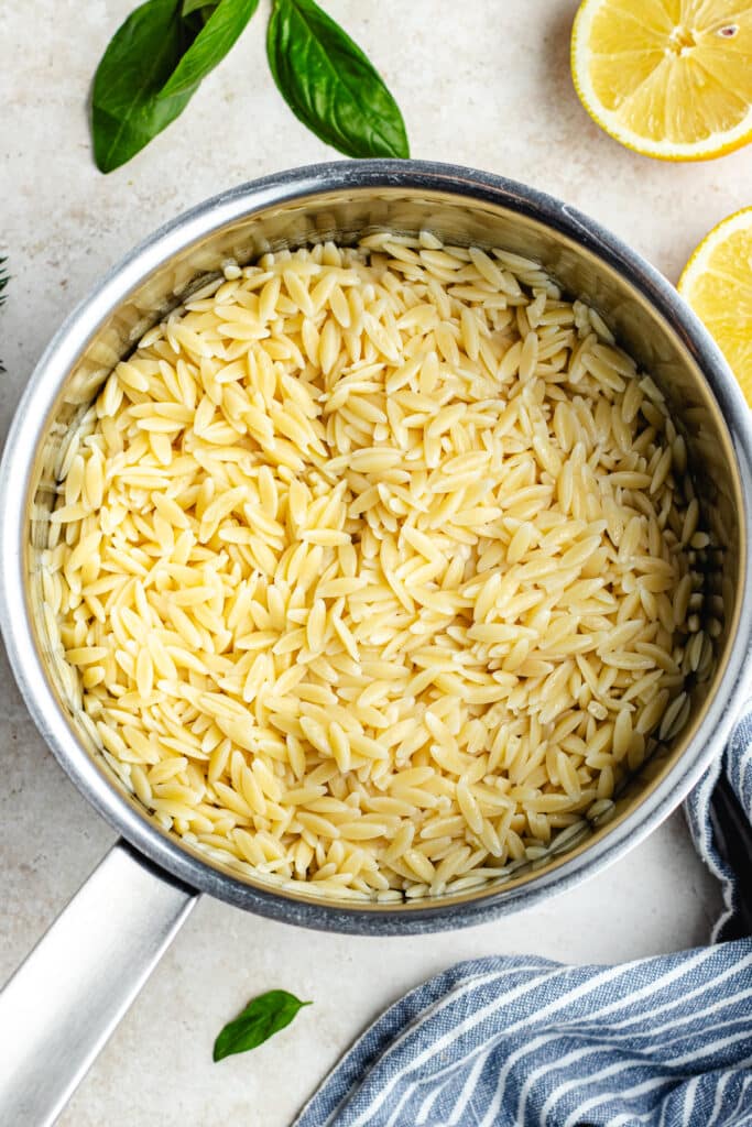 The cooked orzo in a sauce pot. 