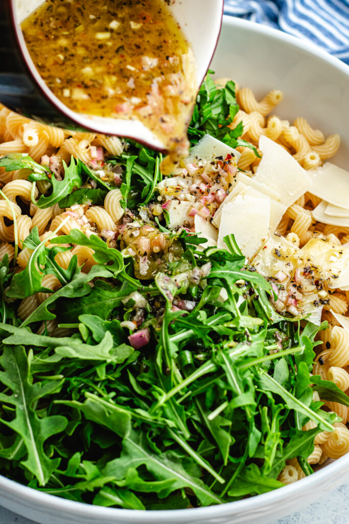 Pouring over the dressing.
