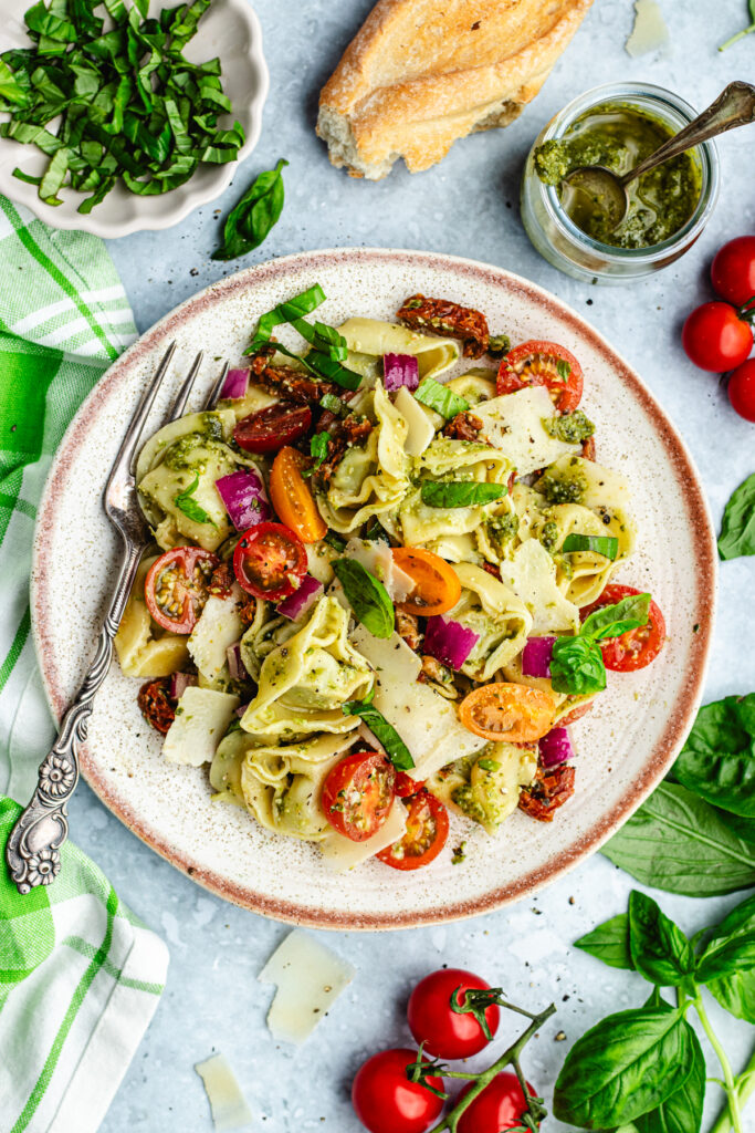 The pesto salad on a small plate with a fork.