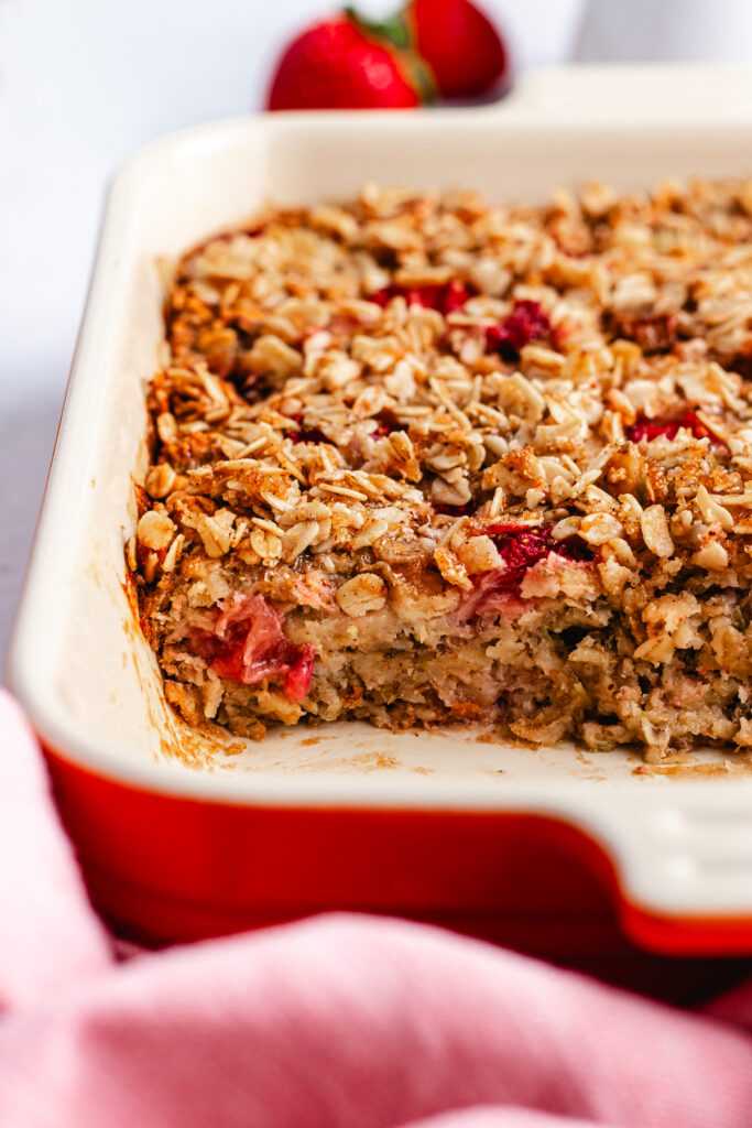 The baked oats cut into pieces in the baking dish.