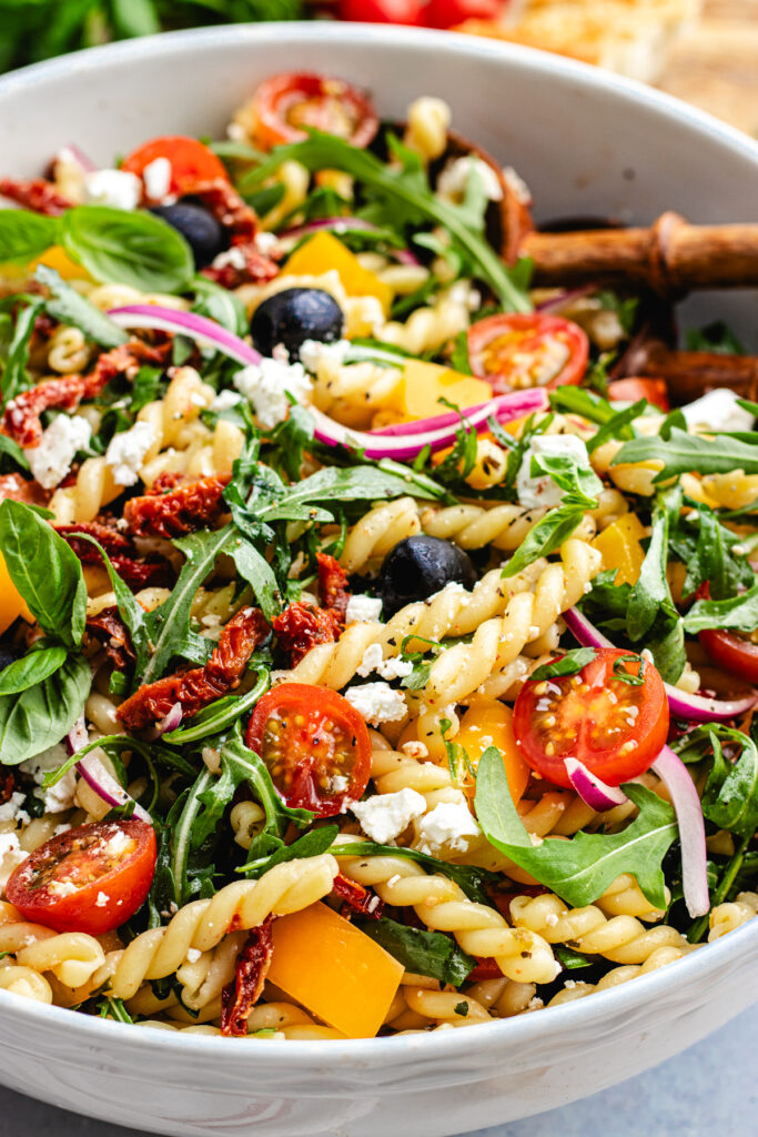 The pasta salad in a large bowl.