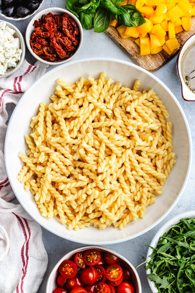 The cooked pasta in a salad bowl.