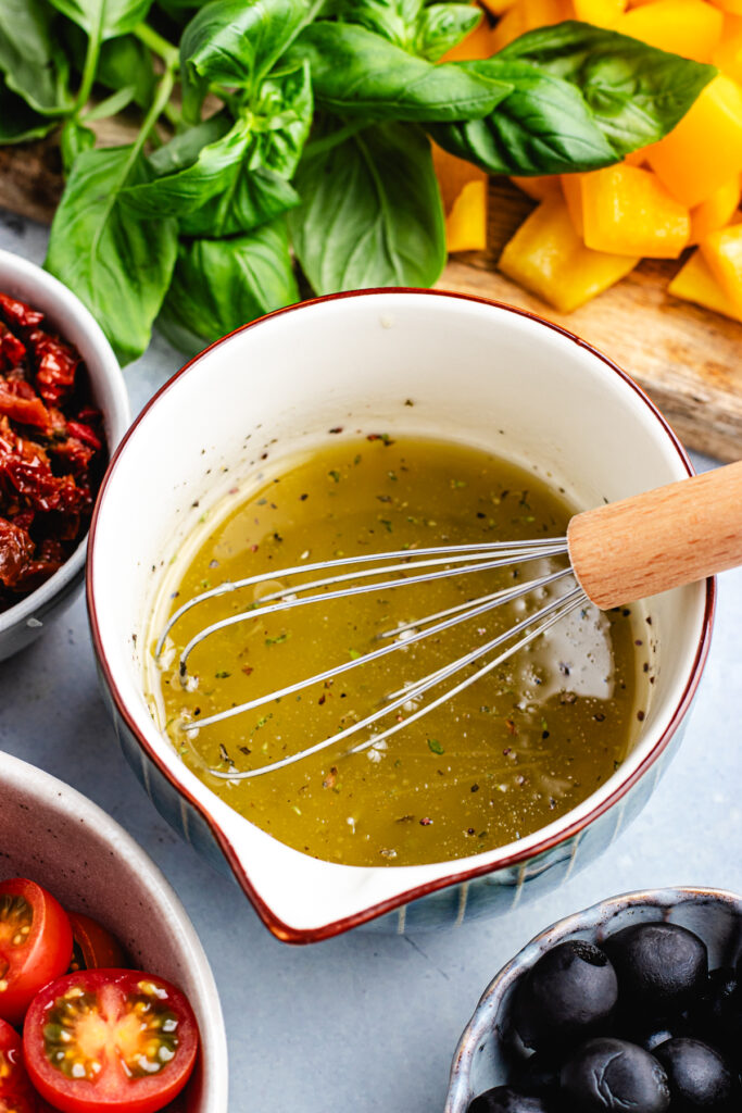 The dressing in a small bowl.