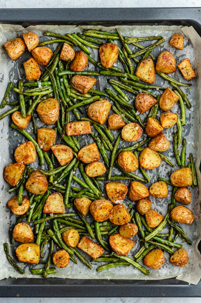 The roasted vegetables on the baking sheet.