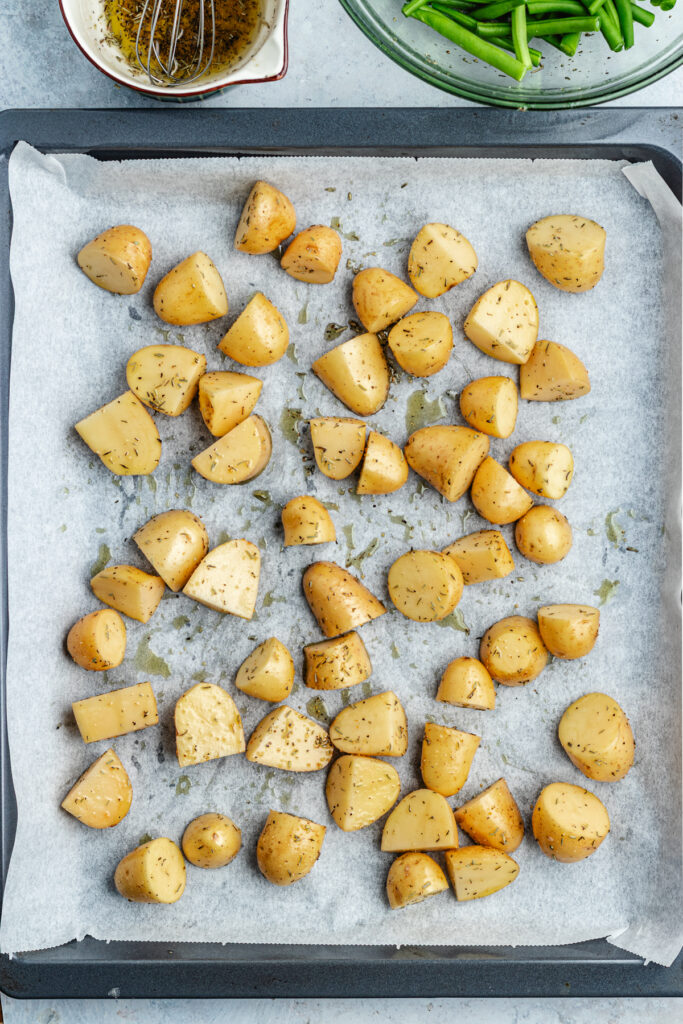 The potatoes on a baking sheet.