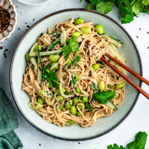 The noodle salad in a bowl with chopsticks.