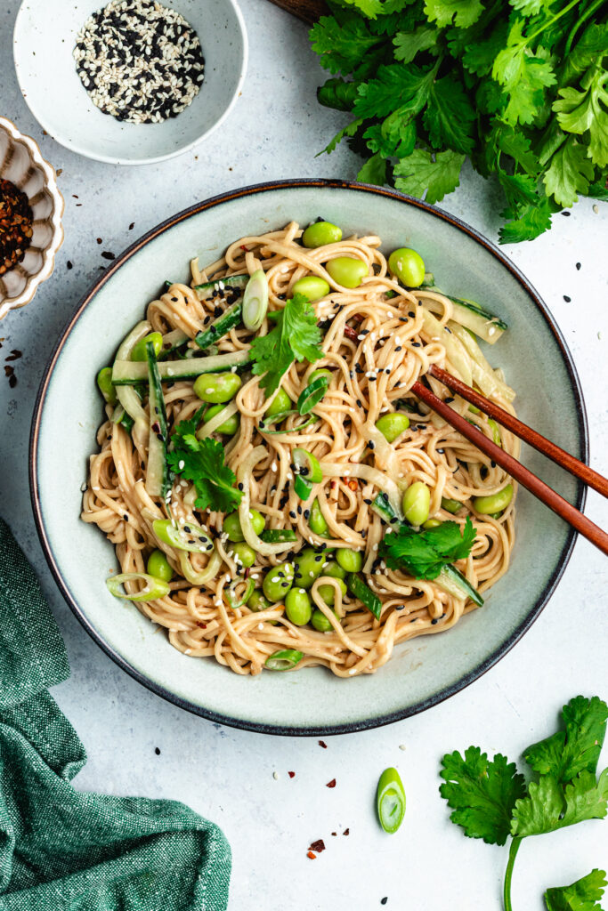 The noodle salad in a bowl with chopsticks. 