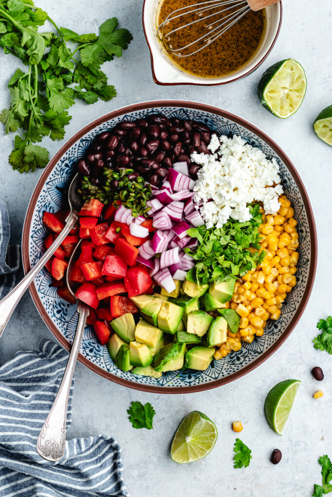 All the ingredients for the salad in a bowl.