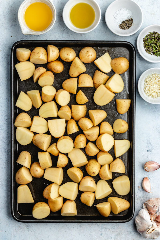 The potatoes on a baking sheet.