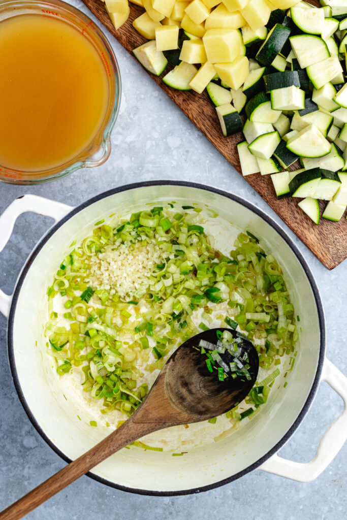 The sautéed leek in the pot with the added garlic.