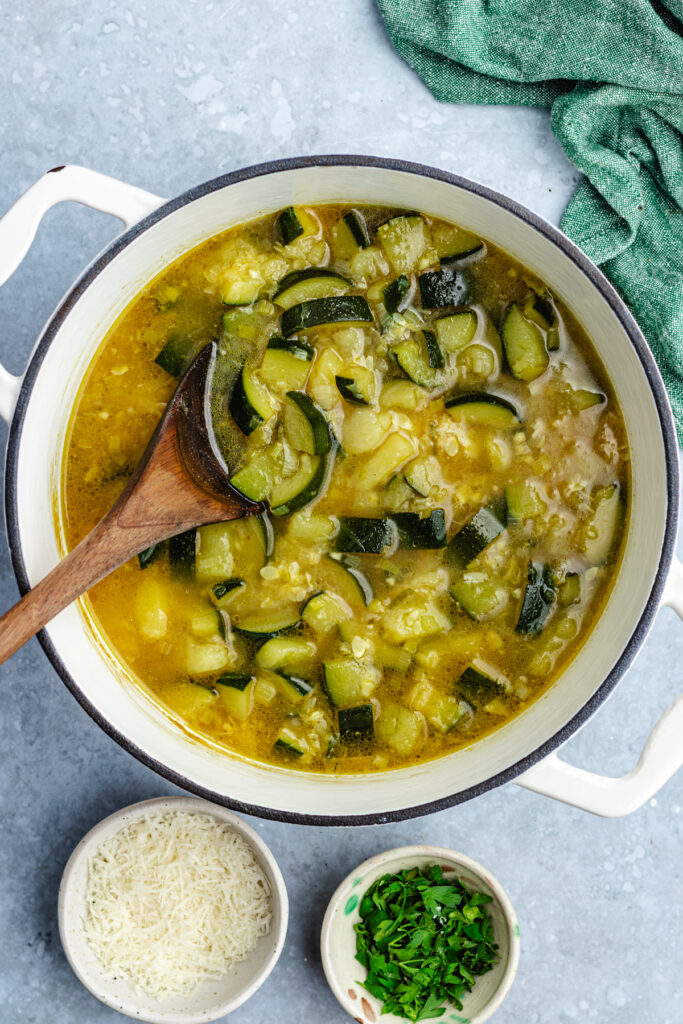 The cooked vegetables in the pot.