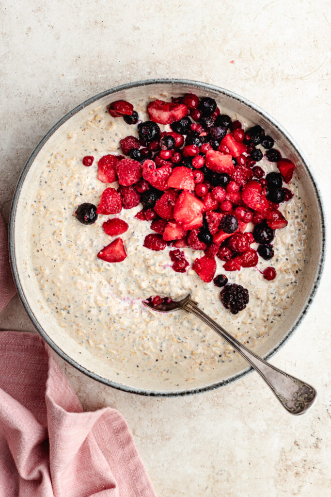 The added berries to the bowl.