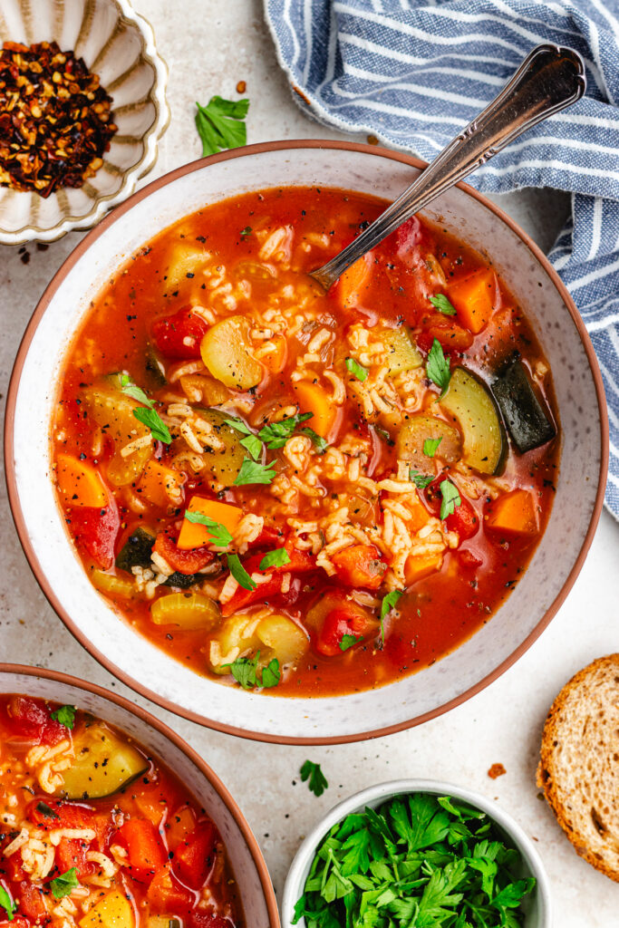 The soup in two bowls, topped with chopped parsley.