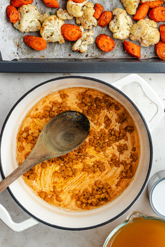 The sautéed onions with the garlic and spices in the soup pot.