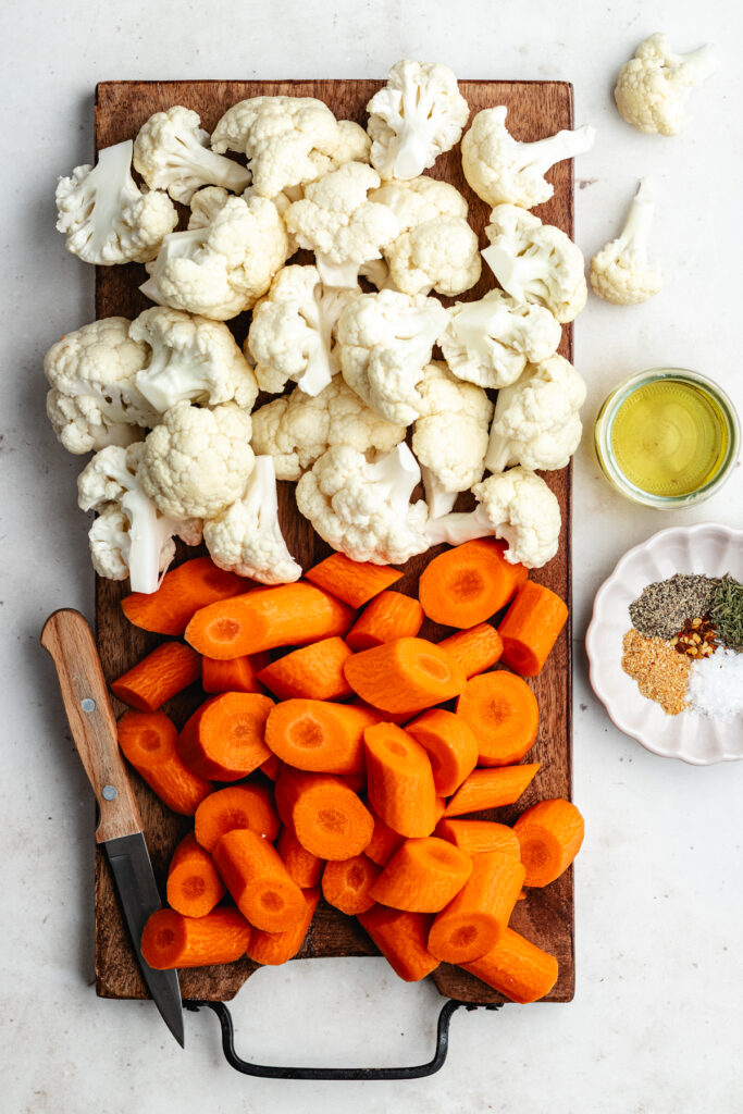 The chopped vegetables on a cutting board.
