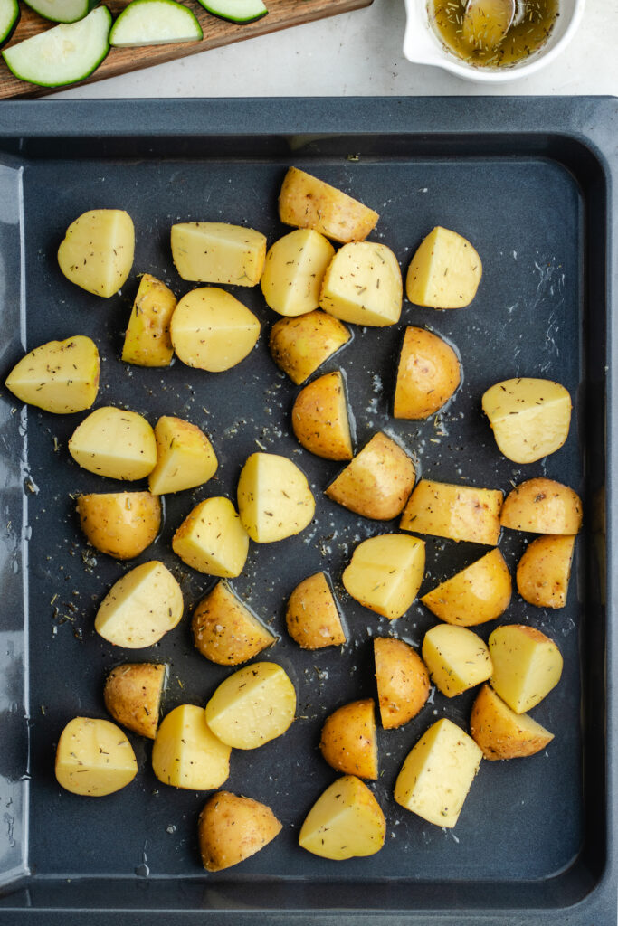 The potatoes on a sheet pan.