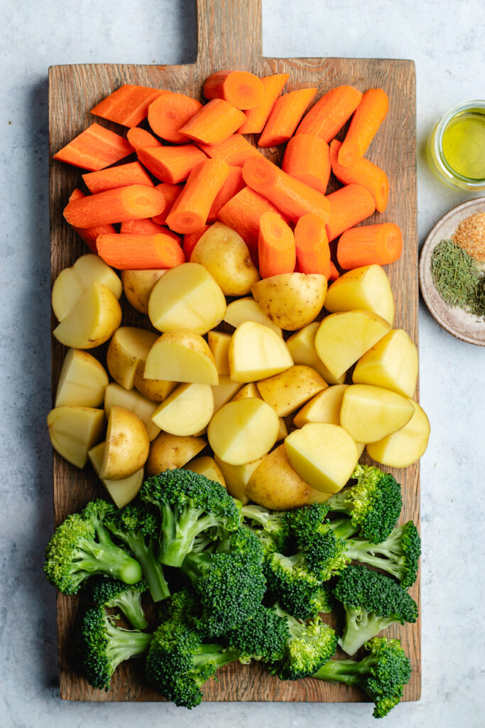 The chopped veggies on the cutting board.
