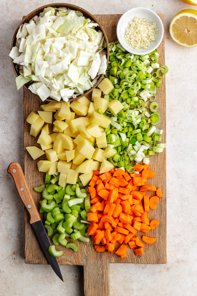 The chopped veggies on the cutting board.