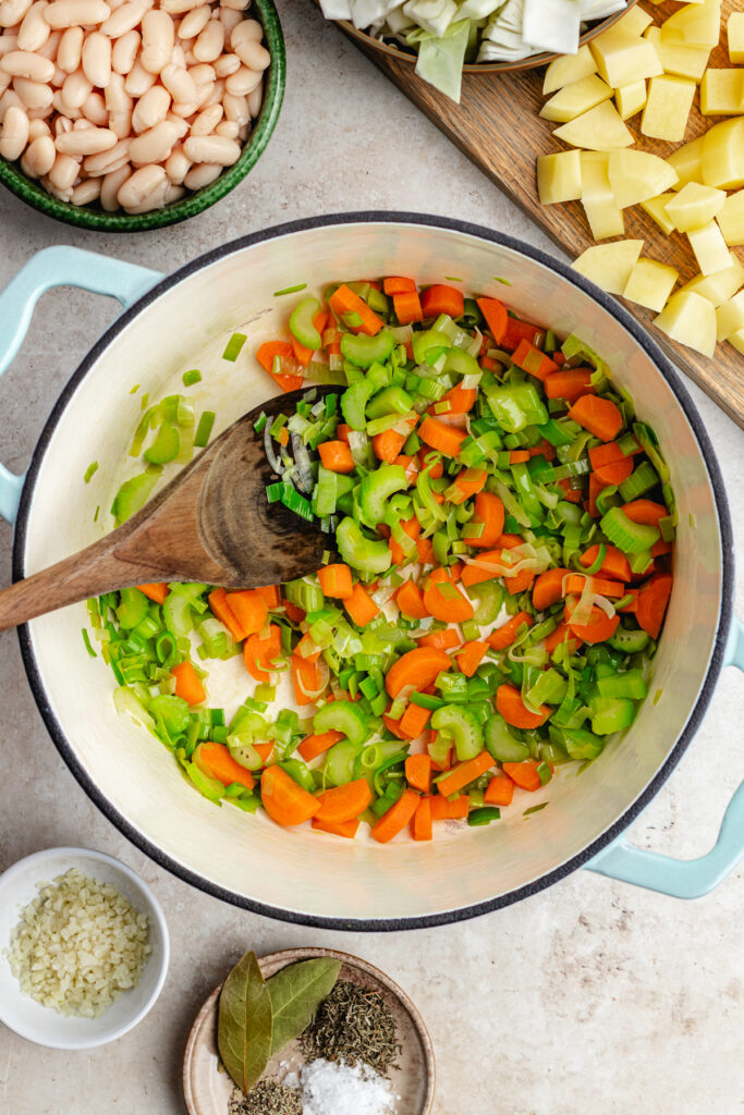 The sautéed veggies in the soup pot.
