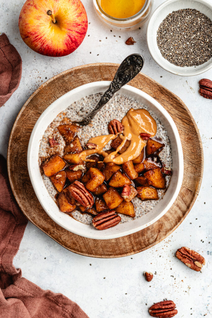 The chia pudding topped with apples, nut butter and pecans.