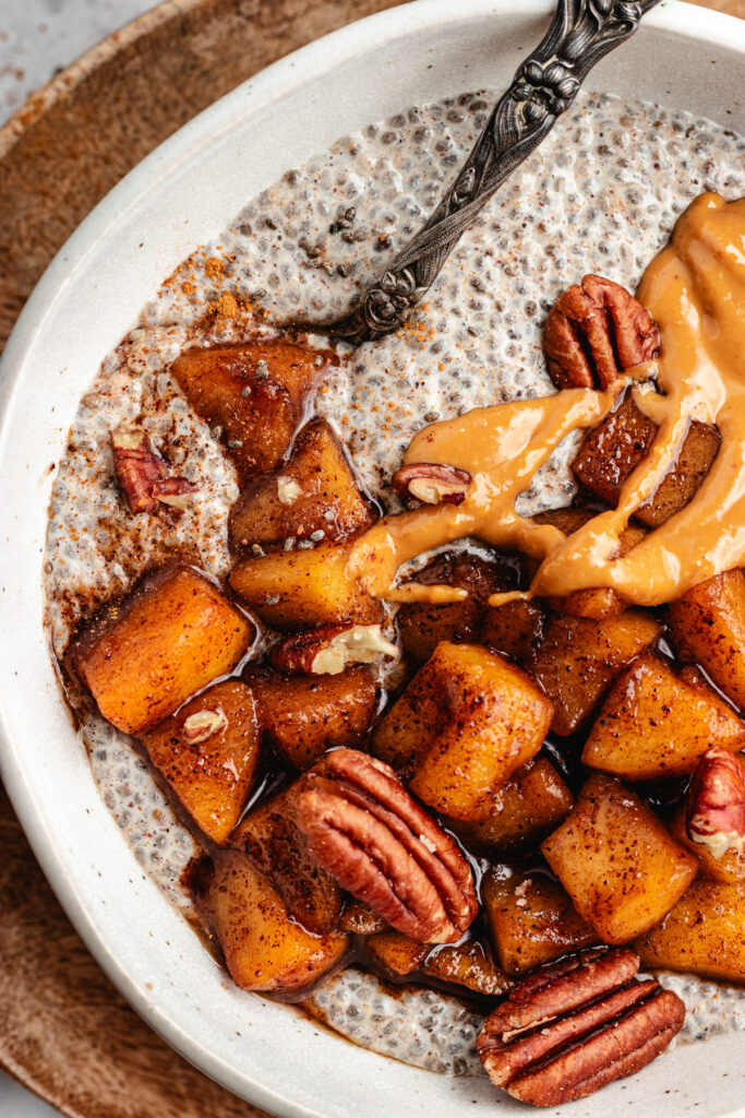 The chia pudding topped with apples, nut butter and pecans.