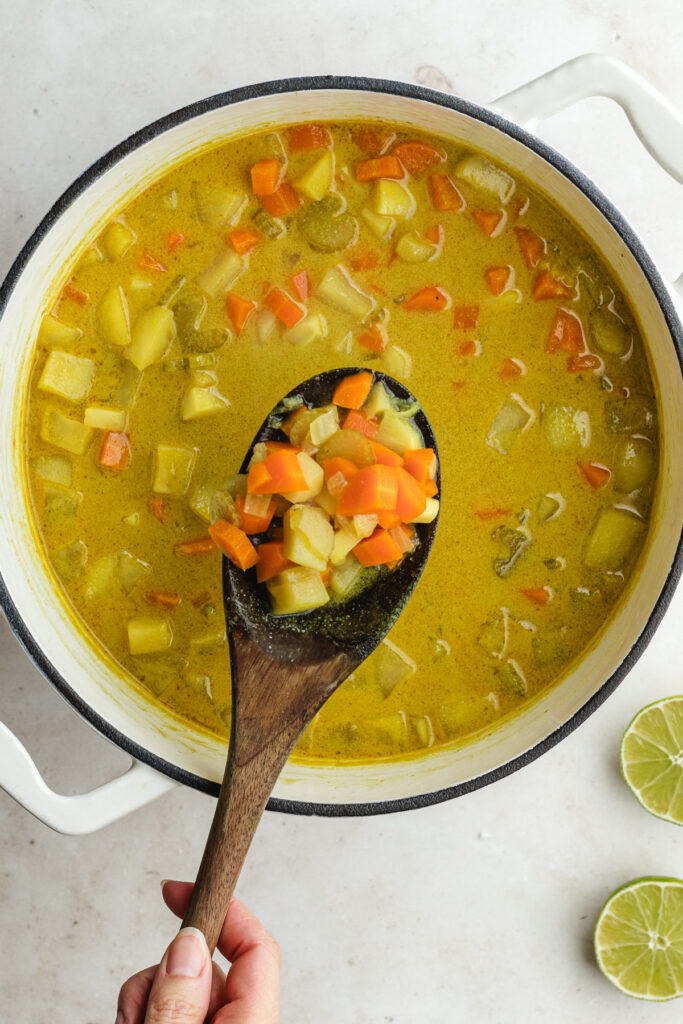 The cooked vegetables on a spoon.