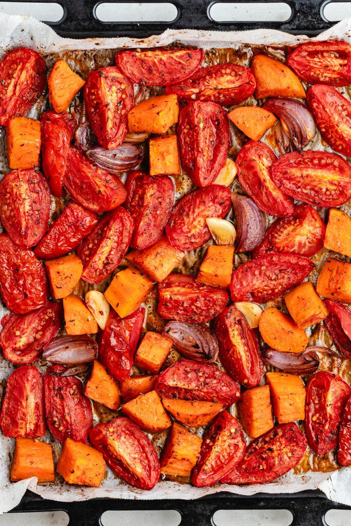The roasted veggies on the sheet pan.
