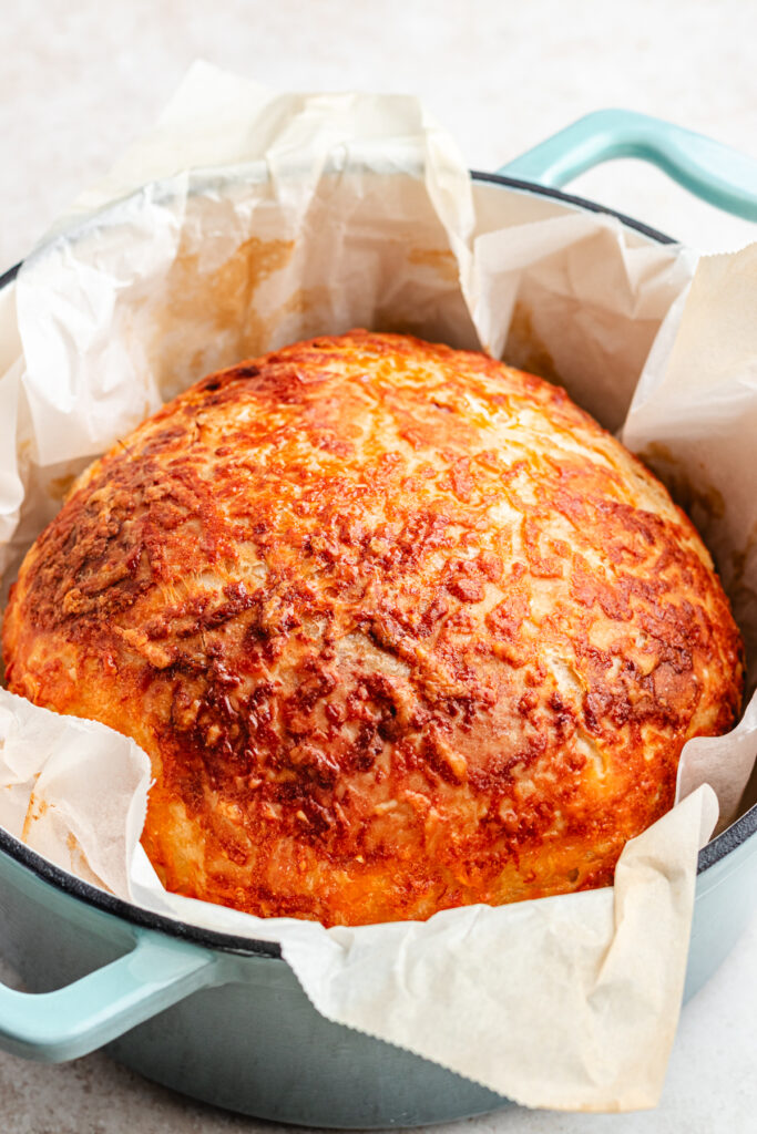 The baked bread in the dutch oven.