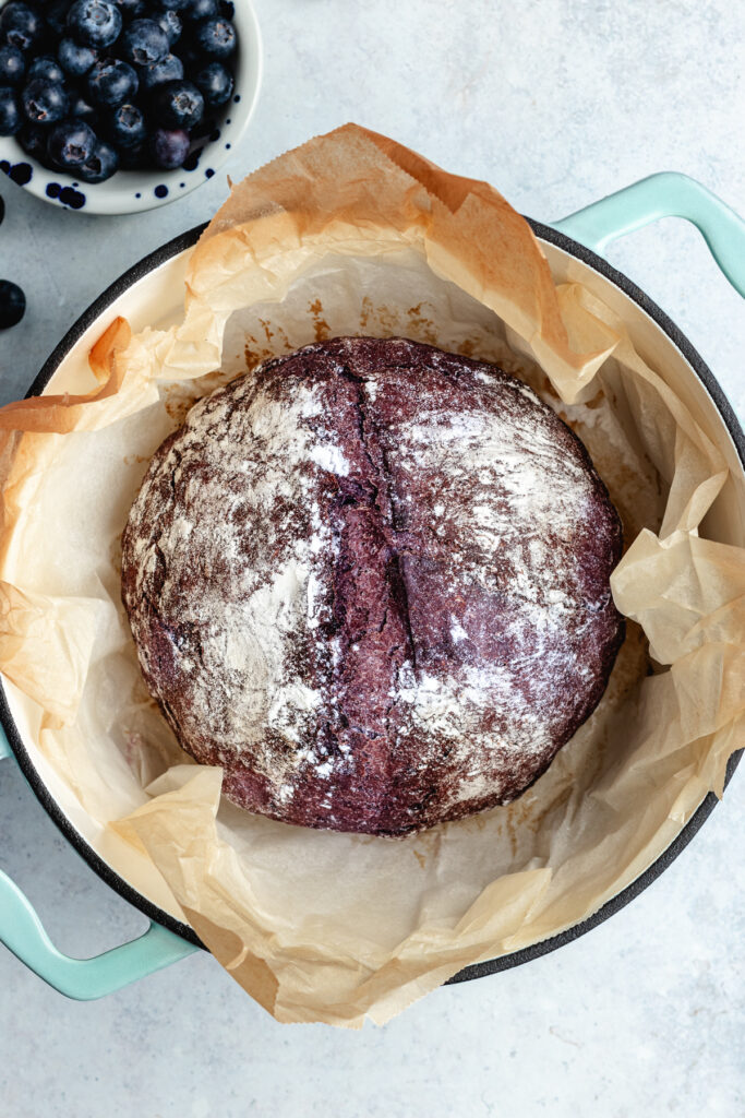 The baked bread in the Dutch oven.
