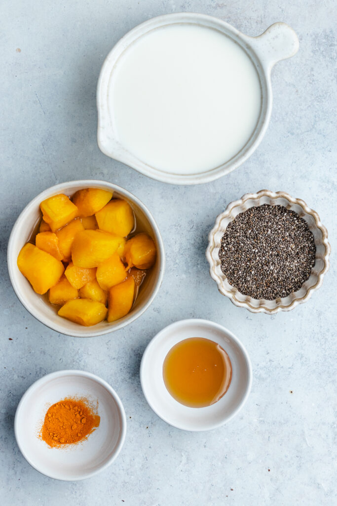 The ingredients for the chia pudding in small bowls.